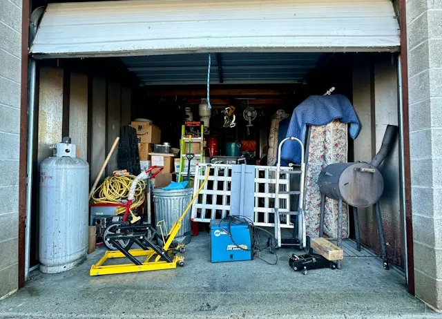 Garage cleanout service in Las Cruces NM — before photo of cluttered one-car garage